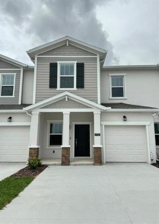 Front exterior of a new home in , Davenport, FL, highlighting curb appeal (Image 1). Front exterior of a new home in , Davenport, FL, highlighting curb appeal (Image 1).