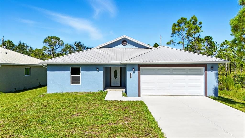 Front exterior of a new home in , Punta Gorda, FL, highlighting curb appeal (Image 1).