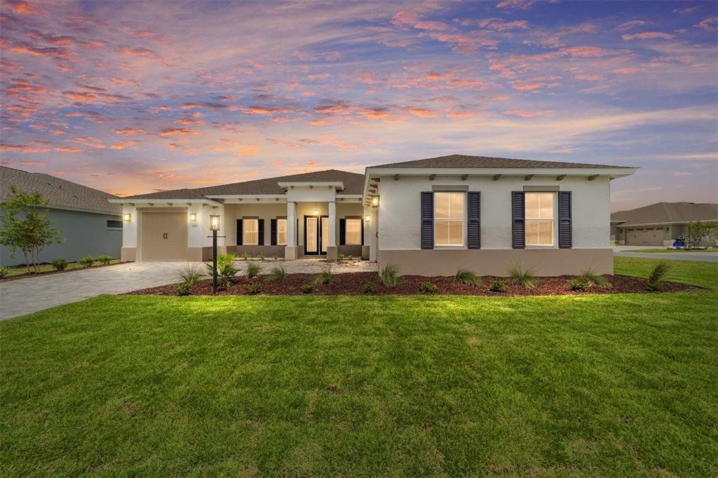 Front exterior of a new home in On Top of the World Communities, Ocala, FL, highlighting curb appeal (Image 1). Front exterior of a new home in On Top of the World Communities, Ocala, FL, highlighting curb appeal (Image 1).