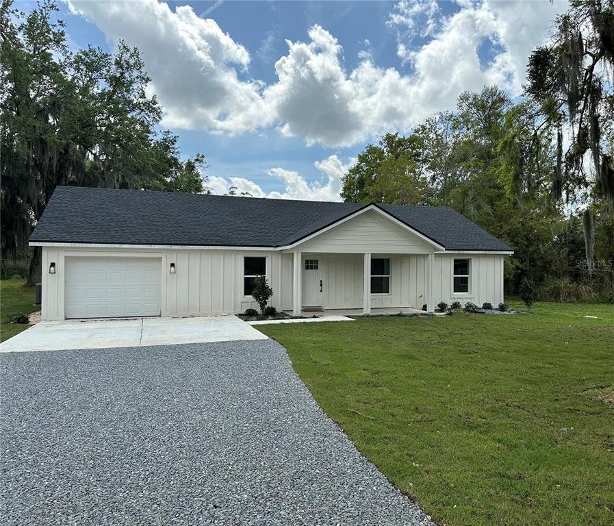 Front exterior of a new home in , Lakeland, FL, highlighting curb appeal (Image 1).