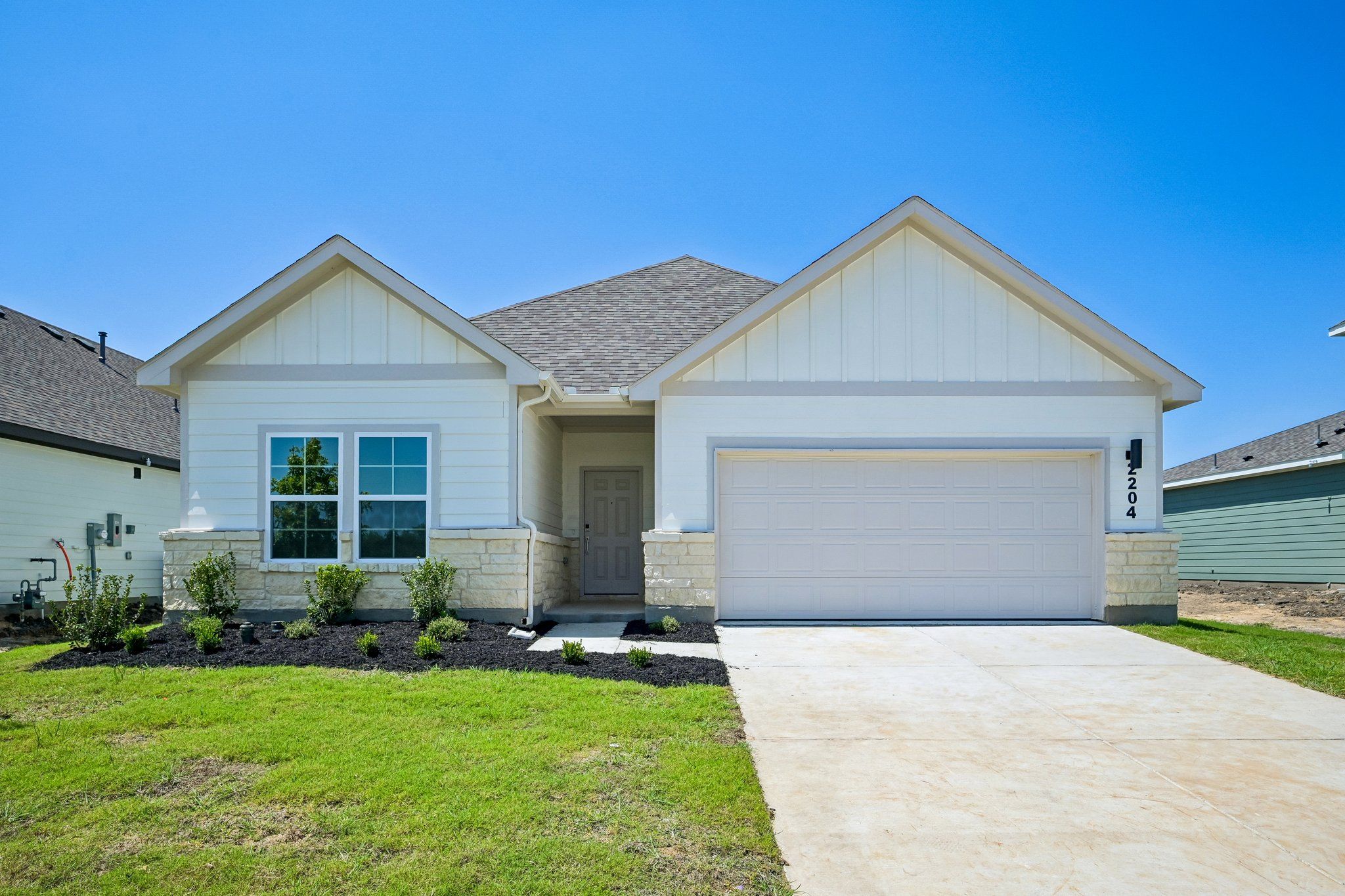 Front exterior of a new home in Hickory Hill, Sherman, TX, highlighting curb appeal (Image 1). Front exterior of a new home in Hickory Hill, Sherman, TX, highlighting curb appeal (Image 1).