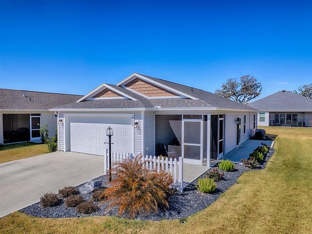 Front exterior of a new home in , The Villages, FL, highlighting curb appeal (Image 1). Front exterior of a new home in , The Villages, FL, highlighting curb appeal (Image 1).