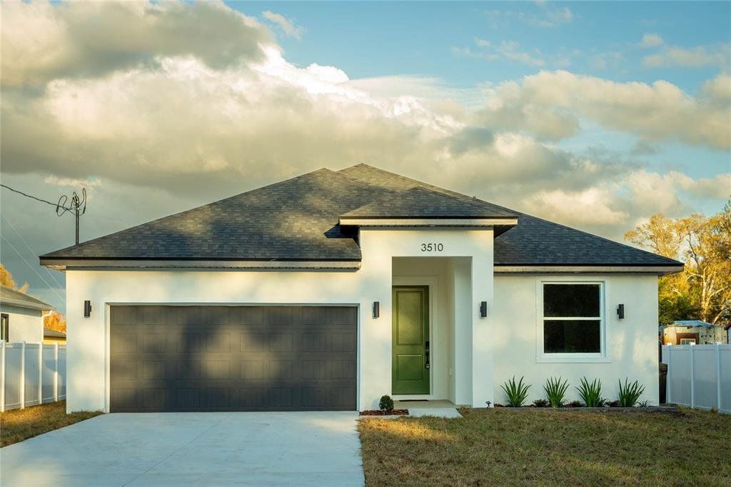 Front exterior of a new home in , Tampa, FL, highlighting curb appeal (Image 1). Front exterior of a new home in , Tampa, FL, highlighting curb appeal (Image 1).