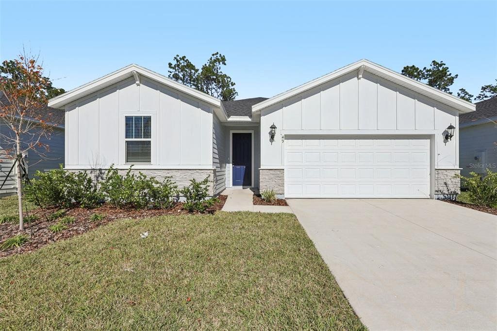 Front exterior of a new home in , Palm Coast, FL, highlighting curb appeal (Image 1). Front exterior of a new home in , Palm Coast, FL, highlighting curb appeal (Image 1).