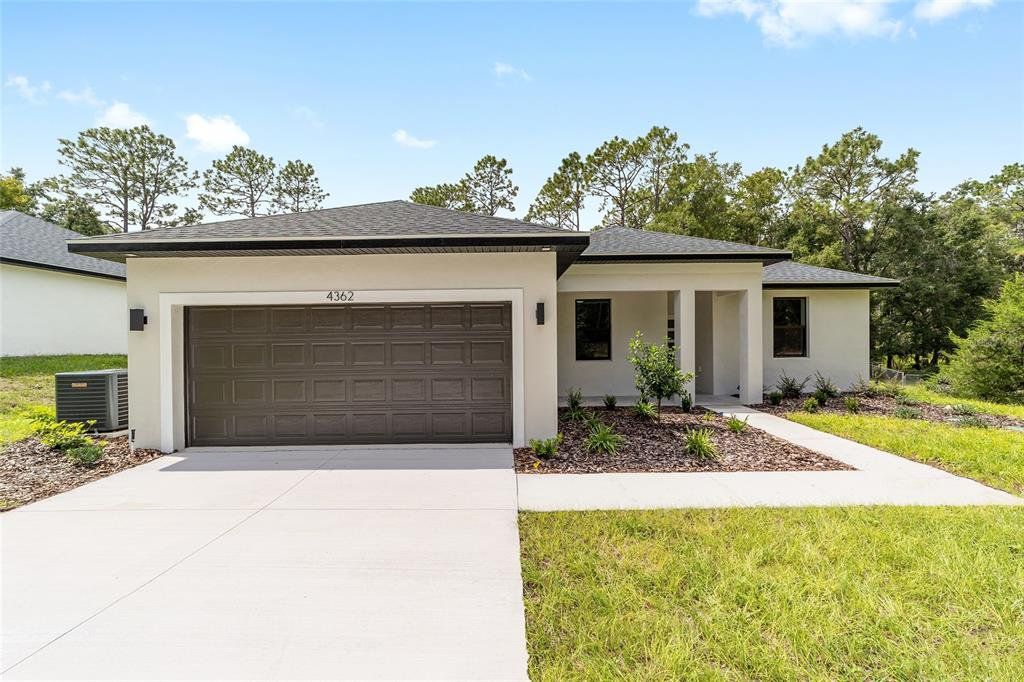 Front exterior of a new home in , Ocala, FL, highlighting curb appeal (Image 1). Front exterior of a new home in , Ocala, FL, highlighting curb appeal (Image 1).