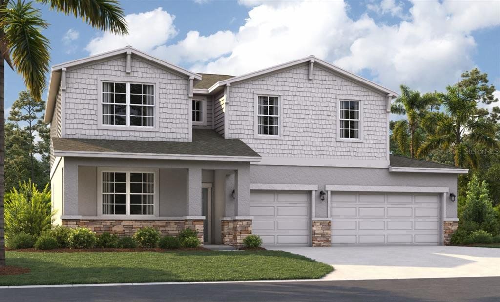 Front exterior of a new home in Groves at Grand Island, Grand Island, FL, highlighting curb appeal (Image 1). Front exterior of a new home in Groves at Grand Island, Grand Island, FL, highlighting curb appeal (Image 1).