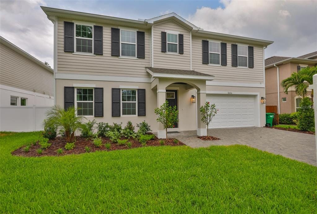 Front exterior of a new home in , Tampa, FL, highlighting curb appeal (Image 1). Front exterior of a new home in , Tampa, FL, highlighting curb appeal (Image 1).