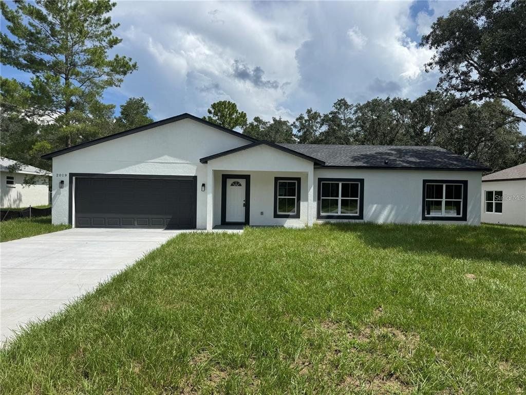 Front exterior of a new home in , Dunnellon, FL, highlighting curb appeal (Image 1). Front exterior of a new home in , Dunnellon, FL, highlighting curb appeal (Image 1).