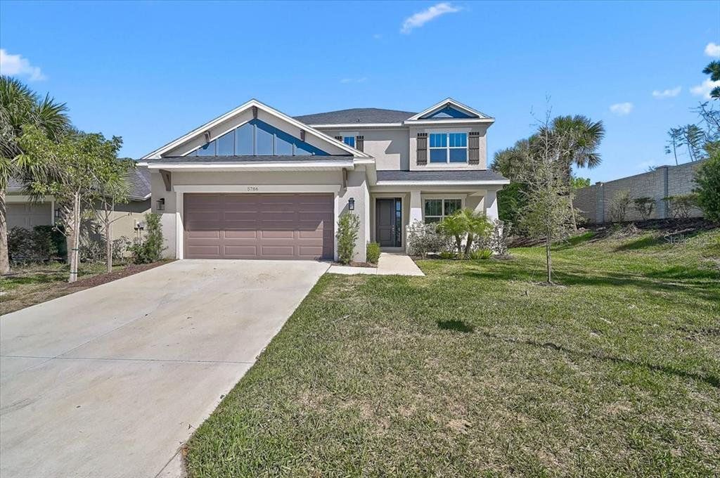 Front exterior of a new home in , Sarasota, FL, highlighting curb appeal (Image 1). Front exterior of a new home in , Sarasota, FL, highlighting curb appeal (Image 1).