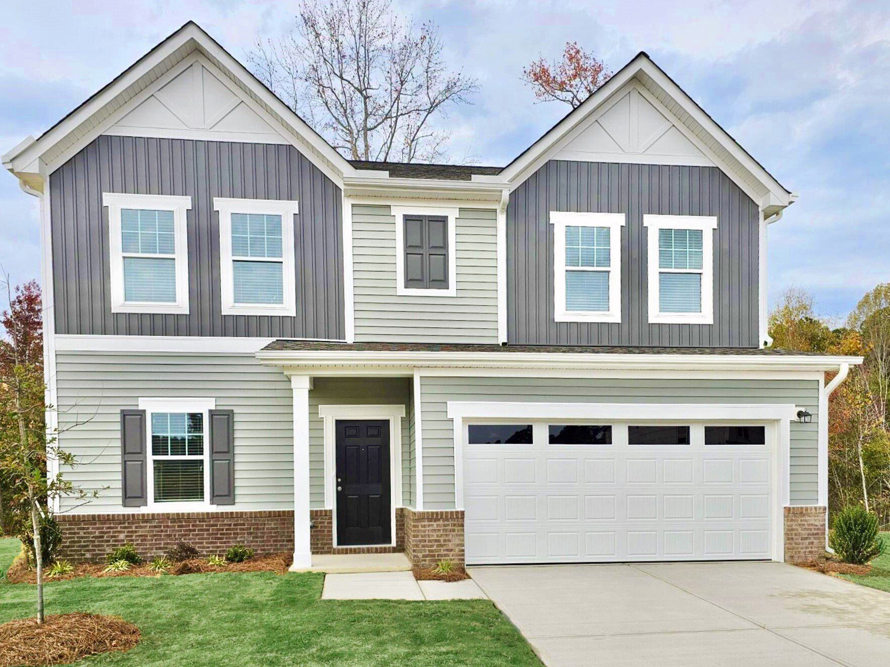 Front exterior of a new home in The Summit at Carters Station, Columbia, TN, highlighting curb appeal (Image 1).