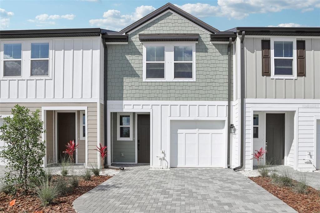 Front exterior of a new home in Montague Chase, Tampa, FL, highlighting curb appeal (Image 1). Front exterior of a new home in Montague Chase, Tampa, FL, highlighting curb appeal (Image 1).