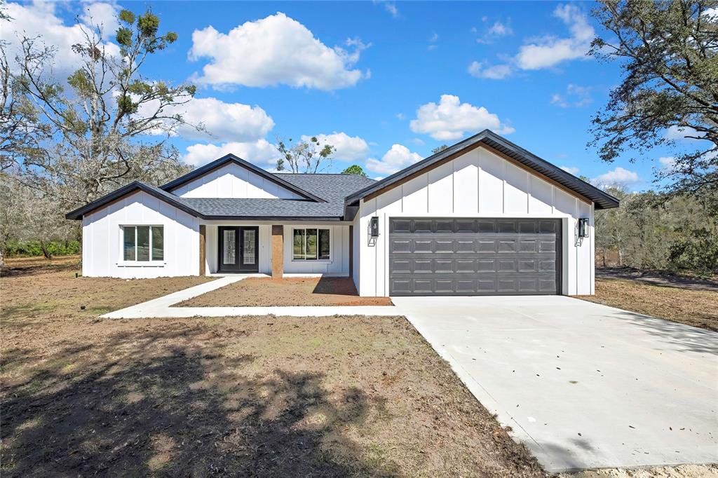 Front exterior of a new home in , Crystal River, FL, highlighting curb appeal (Image 1). Front exterior of a new home in , Crystal River, FL, highlighting curb appeal (Image 1).