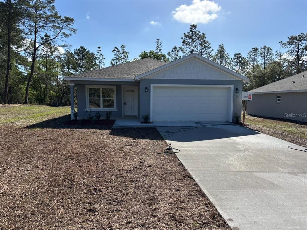 Front exterior of a new home in , Dunnellon, FL, highlighting curb appeal (Image 1). Front exterior of a new home in , Dunnellon, FL, highlighting curb appeal (Image 1).