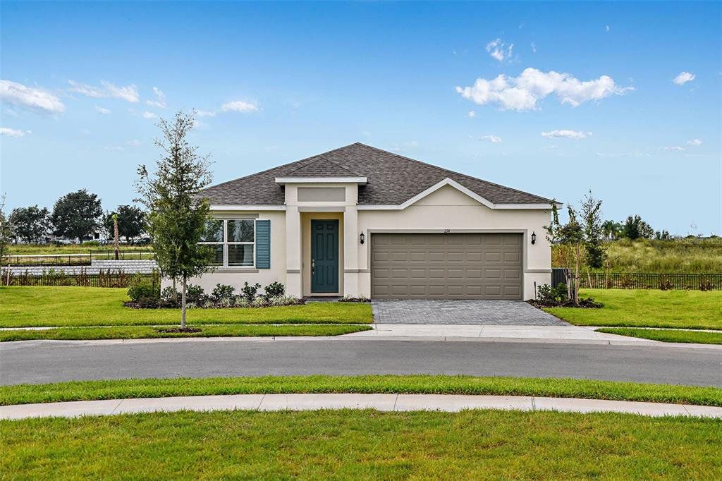 Front exterior of a new home in Mirror Lake Village, Fruitland Park, FL, highlighting curb appeal (Image 1). Front exterior of a new home in Mirror Lake Village, Fruitland Park, FL, highlighting curb appeal (Image 1).