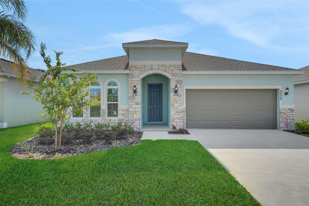 Front exterior of a new home in Annabelle Estates, Lake Wales, FL, highlighting curb appeal (Image 1). Front exterior of a new home in Annabelle Estates, Lake Wales, FL, highlighting curb appeal (Image 1).