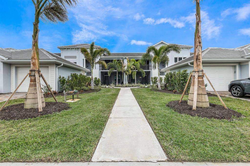 Front exterior of a new home in , Punta Gorda, FL, highlighting curb appeal (Image 1). Front exterior of a new home in , Punta Gorda, FL, highlighting curb appeal (Image 1).