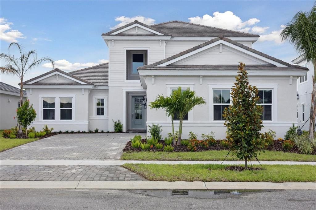 Front exterior of a new home in , Venice, FL, highlighting curb appeal (Image 1). Front exterior of a new home in , Venice, FL, highlighting curb appeal (Image 1).