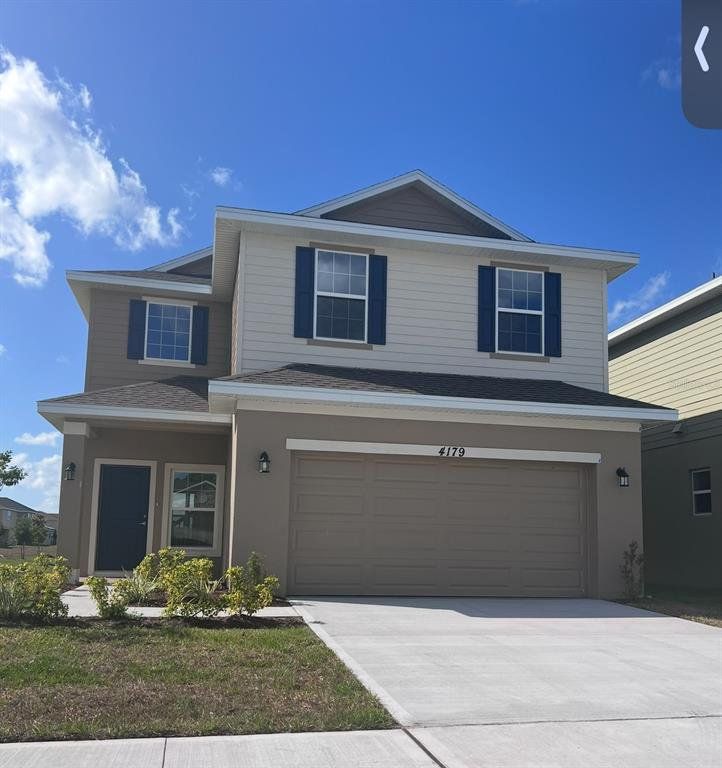 Front exterior of a new home in Harmony Central, St. Cloud, FL, highlighting curb appeal (Image 1).