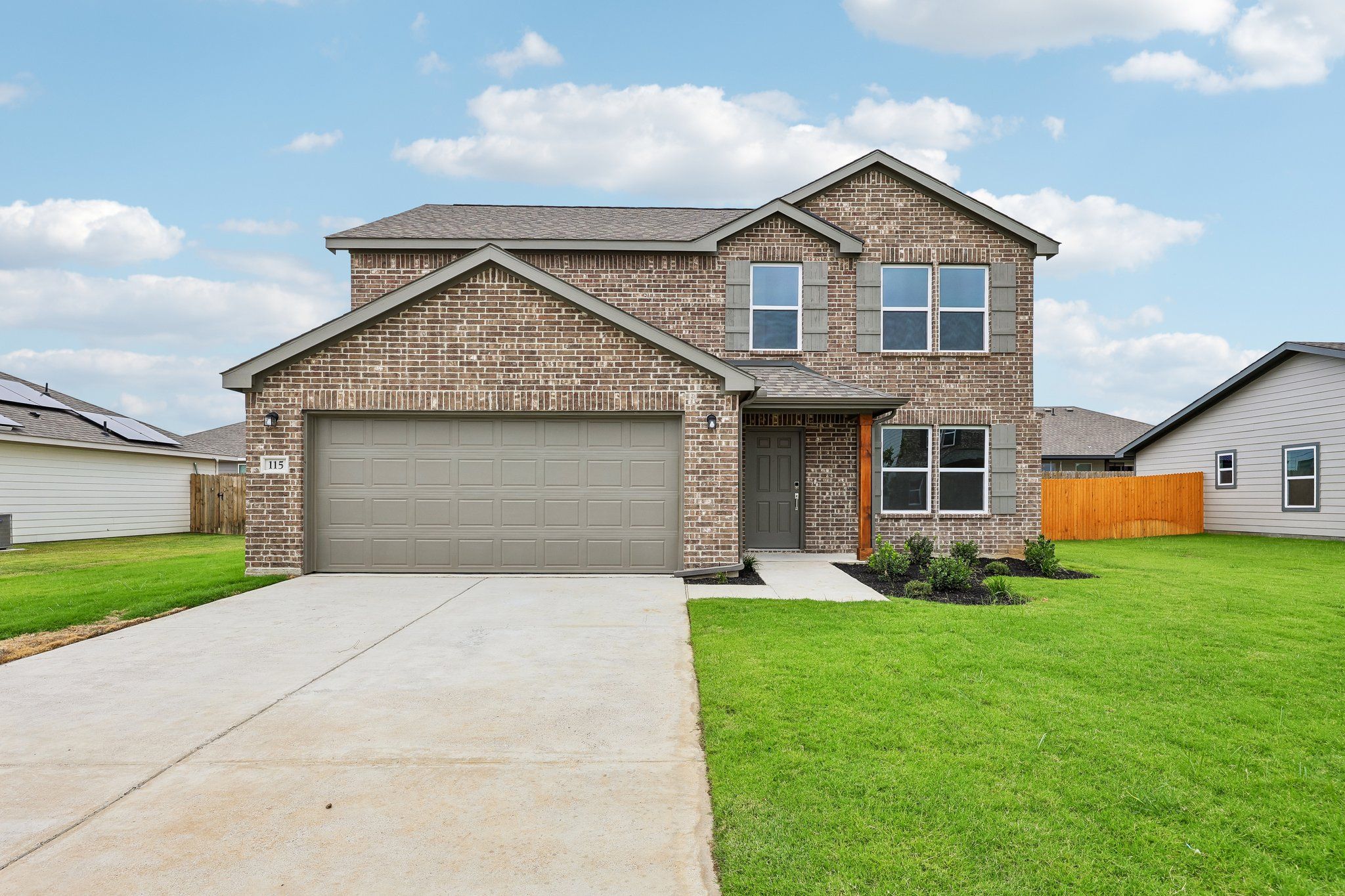 Front exterior of a new home in Courtland Place, Cleburne, TX, highlighting curb appeal (Image 1). Front exterior of a new home in Courtland Place, Cleburne, TX, highlighting curb appeal (Image 1).