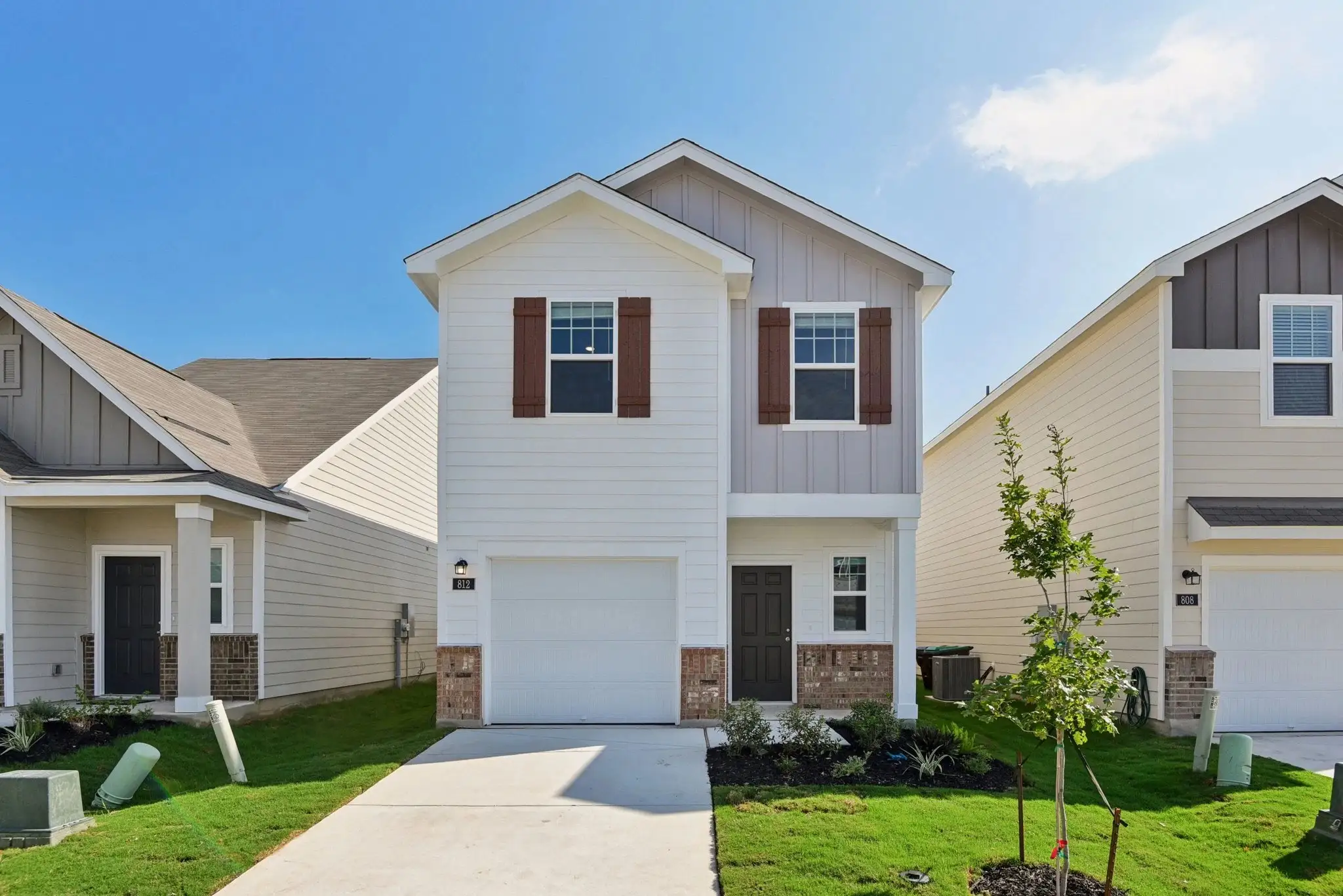 Front exterior of a new home in Sutton Farms, San Antonio, TX, highlighting curb appeal (Image 1). Front exterior of a new home in Sutton Farms, San Antonio, TX, highlighting curb appeal (Image 1).