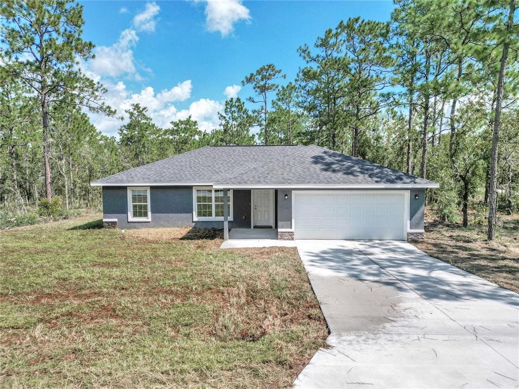 Front exterior of a new home in , Ocala, FL, highlighting curb appeal (Image 1). Front exterior of a new home in , Ocala, FL, highlighting curb appeal (Image 1).