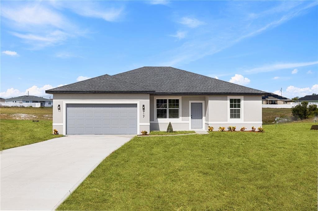 Front exterior of a new home in , Poinciana, FL, highlighting curb appeal (Image 1). Front exterior of a new home in , Poinciana, FL, highlighting curb appeal (Image 1).
