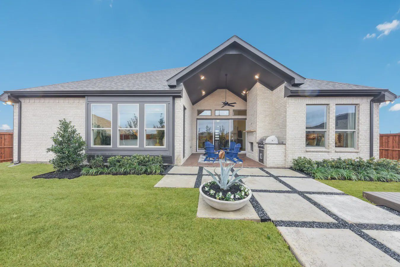 Front exterior of a new home in Oaks of North Grove, Waxahachie, TX, highlighting curb appeal (Image 1). Front exterior of a new home in Oaks of North Grove, Waxahachie, TX, highlighting curb appeal (Image 1).