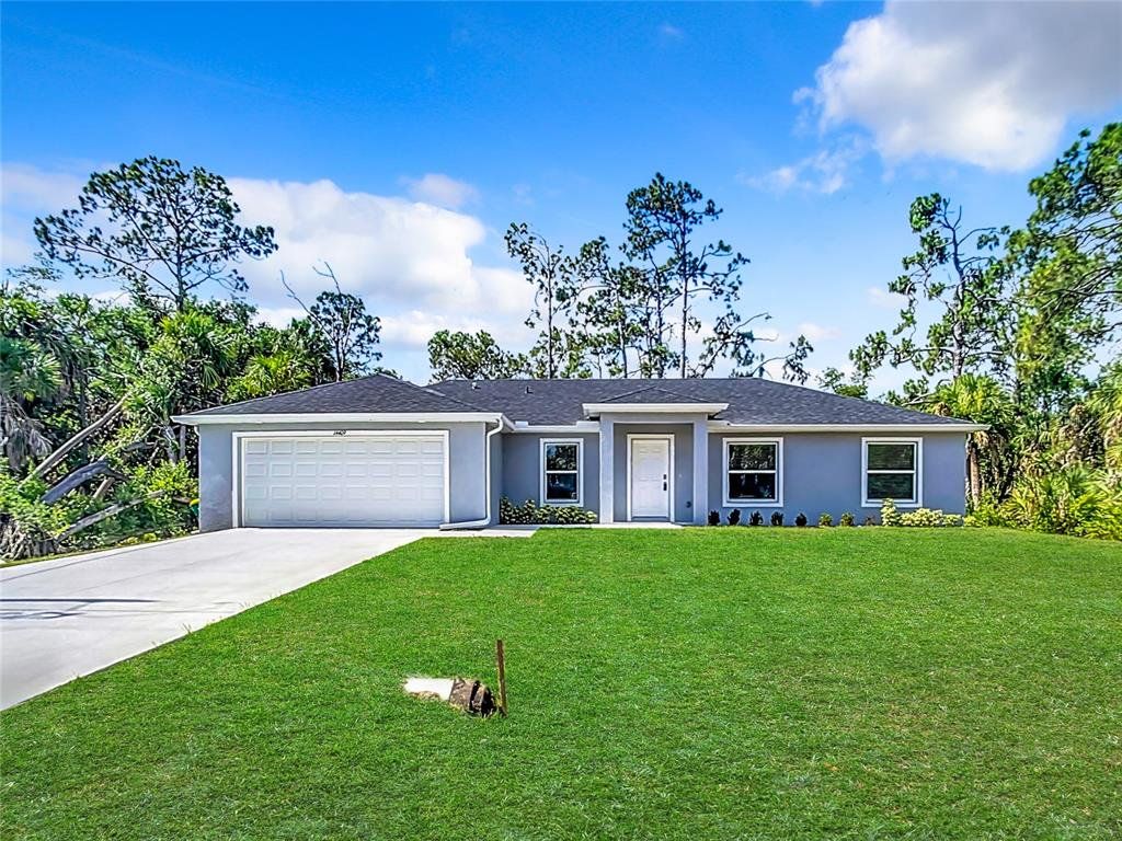Front exterior of a new home in , Port Charlotte, FL, highlighting curb appeal (Image 1). Front exterior of a new home in , Port Charlotte, FL, highlighting curb appeal (Image 1).