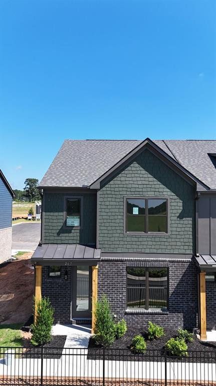 Front exterior of a new home in Tribute, Hoschton, GA, highlighting curb appeal (Image 1). Front exterior of a new home in Tribute, Hoschton, GA, highlighting curb appeal (Image 1).