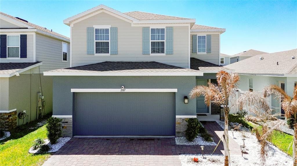 Front exterior of a new home in , Davenport, FL, highlighting curb appeal (Image 1). Front exterior of a new home in , Davenport, FL, highlighting curb appeal (Image 1).