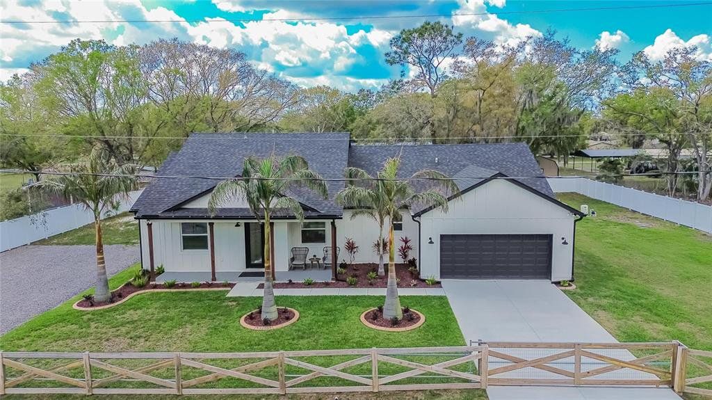 Front exterior of a new home in , Plant City, FL, highlighting curb appeal (Image 1). Front exterior of a new home in , Plant City, FL, highlighting curb appeal (Image 1).