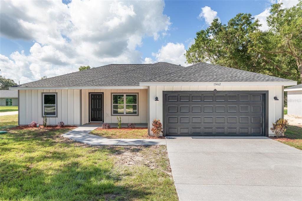 Front exterior of a new home in , Ocala, FL, highlighting curb appeal (Image 1). Front exterior of a new home in , Ocala, FL, highlighting curb appeal (Image 1).