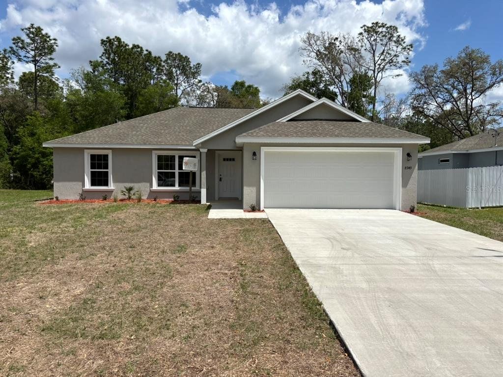 Front exterior of a new home in , Dunnellon, FL, highlighting curb appeal (Image 1). Front exterior of a new home in , Dunnellon, FL, highlighting curb appeal (Image 1).