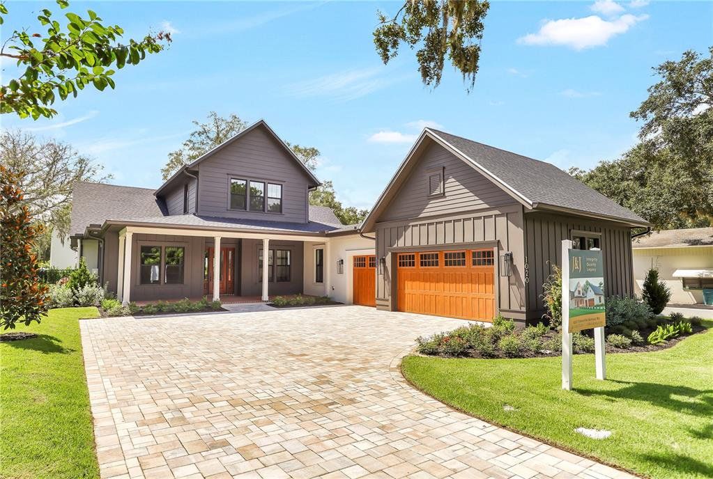 Front exterior of a new home in , Winter Garden, FL, highlighting curb appeal (Image 1). Front exterior of a new home in , Winter Garden, FL, highlighting curb appeal (Image 1).