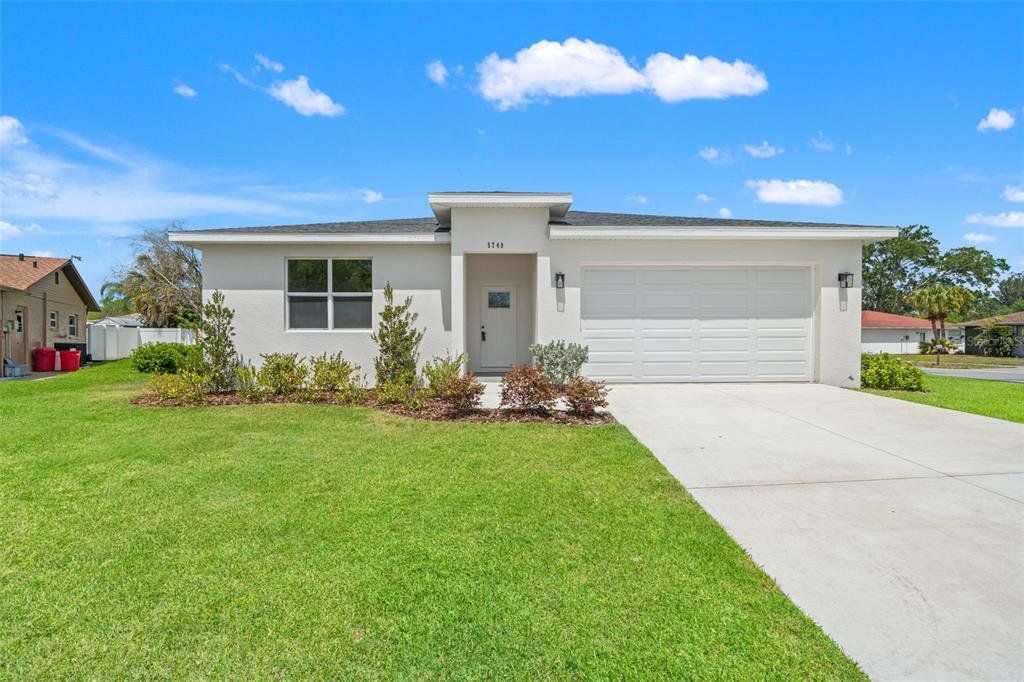 Front exterior of a new home in , Holiday, FL, highlighting curb appeal (Image 1). Front exterior of a new home in , Holiday, FL, highlighting curb appeal (Image 1).