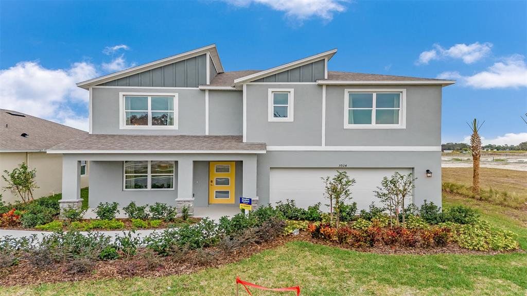 Front exterior of a new home in Buena Lago, St. Cloud, FL, highlighting curb appeal (Image 1). Front exterior of a new home in Buena Lago, St. Cloud, FL, highlighting curb appeal (Image 1).
