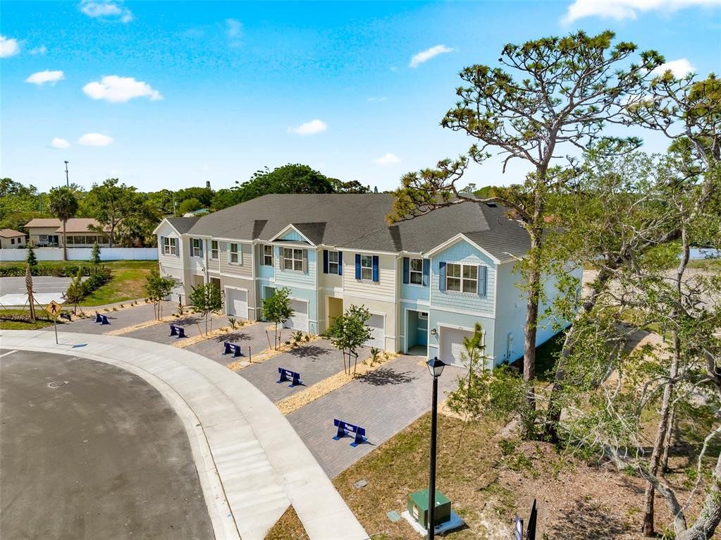 Front exterior of a new home in Kendall Pointe, Melbourne, FL, highlighting curb appeal (Image 1). Front exterior of a new home in Kendall Pointe, Melbourne, FL, highlighting curb appeal (Image 1).
