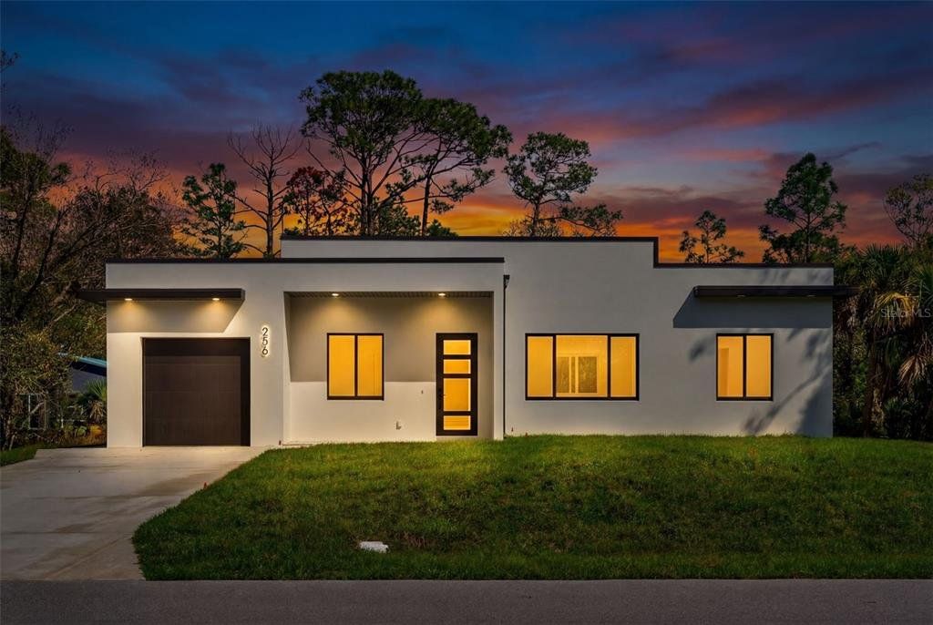 Front exterior of a new home in , Port Charlotte, FL, highlighting curb appeal (Image 1). Front exterior of a new home in , Port Charlotte, FL, highlighting curb appeal (Image 1).