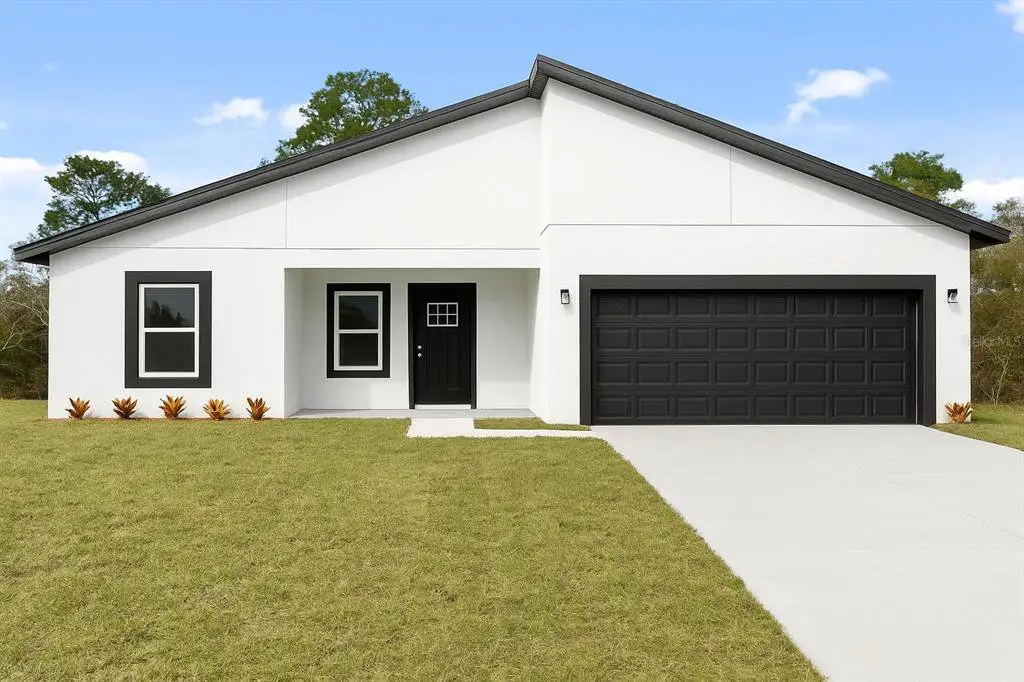 Front exterior of a new home in , Ocala, FL, highlighting curb appeal (Image 1). Front exterior of a new home in , Ocala, FL, highlighting curb appeal (Image 1).