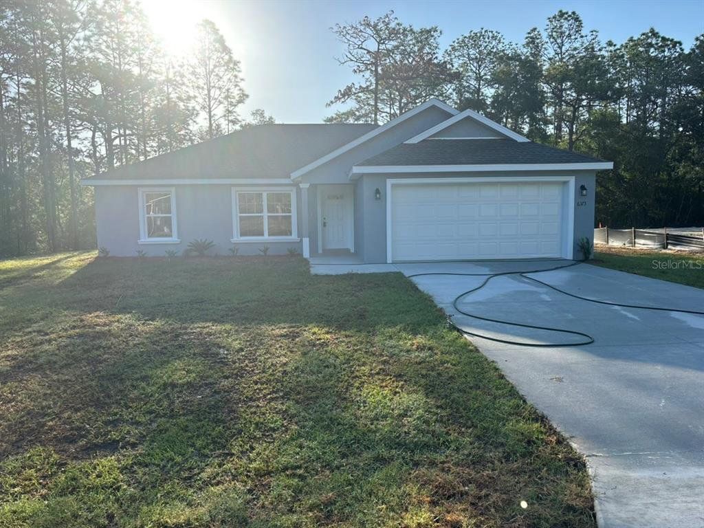 Front exterior of a new home in , Dunnellon, FL, highlighting curb appeal (Image 1). Front exterior of a new home in , Dunnellon, FL, highlighting curb appeal (Image 1).