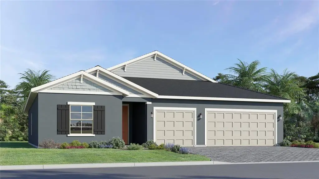Front exterior of a new home in Juliette Falls, Dunnellon, FL, highlighting curb appeal (Image 1). Front exterior of a new home in Juliette Falls, Dunnellon, FL, highlighting curb appeal (Image 1).