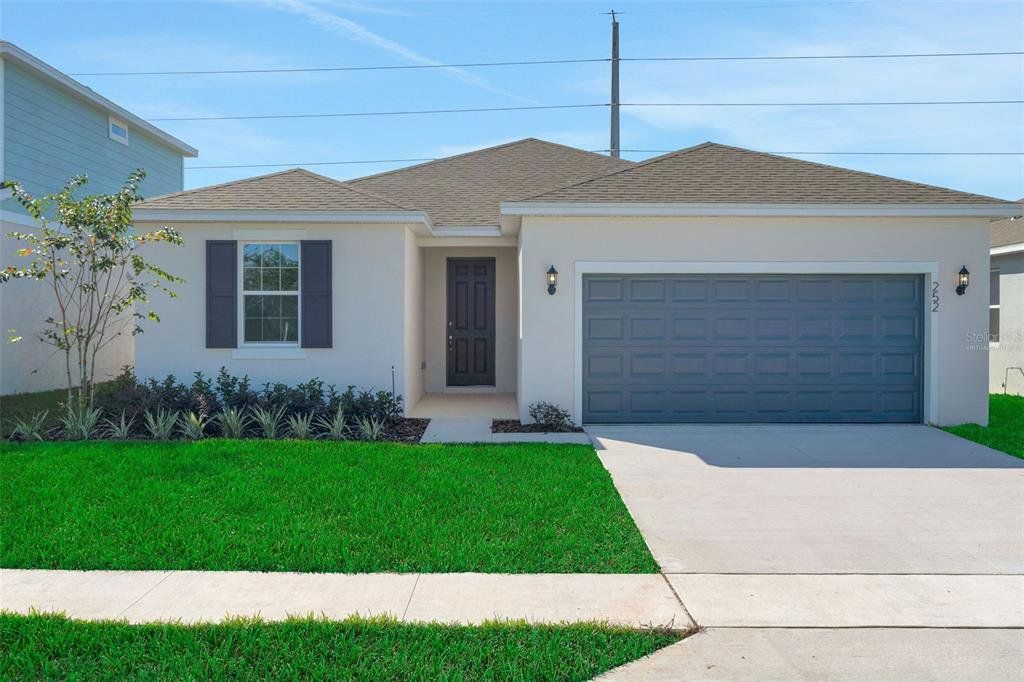 Front exterior of a new home in Willowbrook North, Winter Haven, FL, highlighting curb appeal (Image 1). Front exterior of a new home in Willowbrook North, Winter Haven, FL, highlighting curb appeal (Image 1).