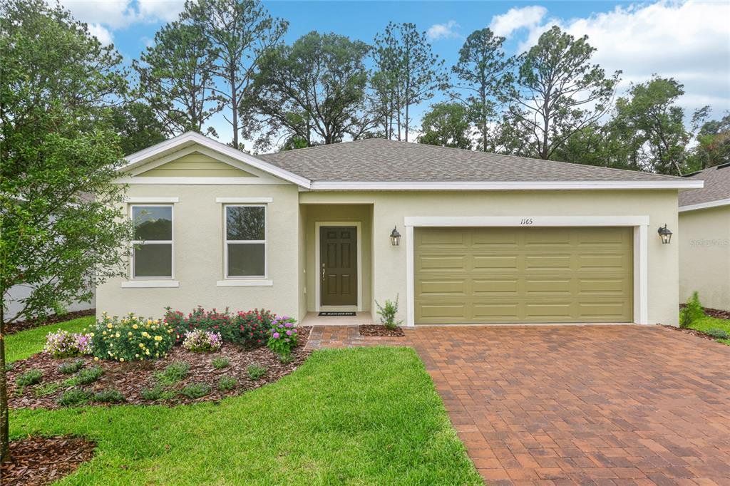 Front exterior of a new home in Beresford Woods, Deland, FL, highlighting curb appeal (Image 1). Front exterior of a new home in Beresford Woods, Deland, FL, highlighting curb appeal (Image 1).