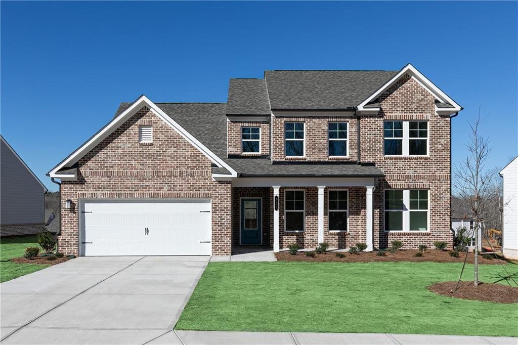 Front exterior of a new home in River Oaks, Locust Grove, GA, highlighting curb appeal (Image 1). Front exterior of a new home in River Oaks, Locust Grove, GA, highlighting curb appeal (Image 1).