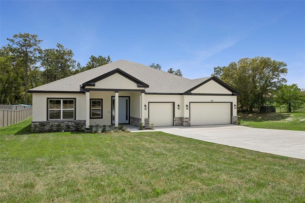 Front exterior of a new home in , Ocala, FL, highlighting curb appeal (Image 1). Front exterior of a new home in , Ocala, FL, highlighting curb appeal (Image 1).