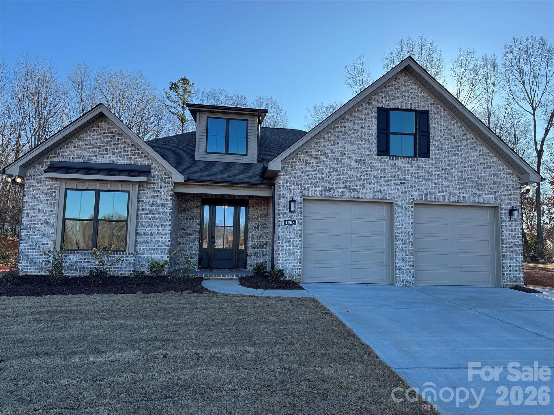 Front exterior of a new home in , Waxhaw, NC, highlighting curb appeal (Image 1). Front exterior of a new home in , Waxhaw, NC, highlighting curb appeal (Image 1).