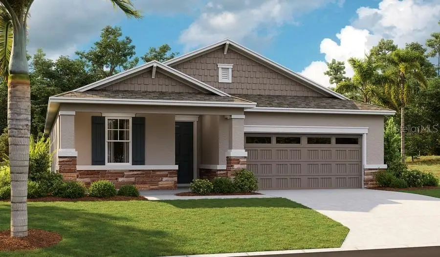 Front exterior of a new home in Seasons at Magnolia Pointe, Umatilla, FL, highlighting curb appeal (Image 1).