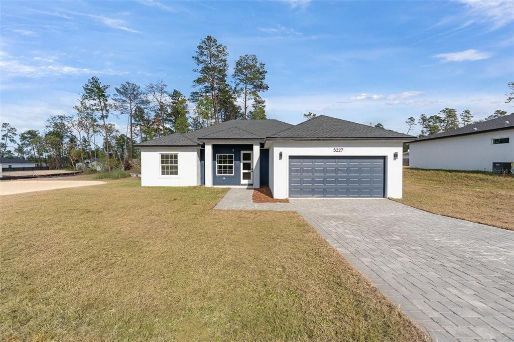 Front exterior of a new home in , Ocala, FL, highlighting curb appeal (Image 1). Front exterior of a new home in , Ocala, FL, highlighting curb appeal (Image 1).