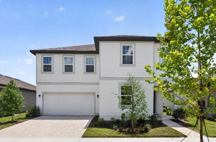 Front exterior of a new home in Hawks Run, Kissimmee, FL, highlighting curb appeal (Image 1). Front exterior of a new home in Hawks Run, Kissimmee, FL, highlighting curb appeal (Image 1).