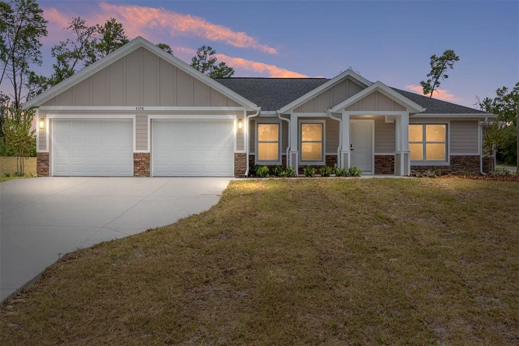 Front exterior of a new home in , Dunnellon, FL, highlighting curb appeal (Image 1). Front exterior of a new home in , Dunnellon, FL, highlighting curb appeal (Image 1).